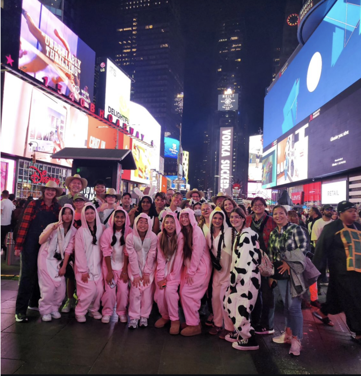 The students dressed like farm animals in Times Square during Halloween.